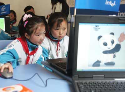 Students use computers to gather information about giant pandas at the 'Intel Kid's PC Workshop' in China.