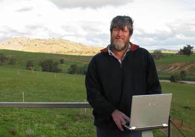 Kelvin Brown is seen working on his laptop from his 175 beef cattle farm near the small Australian town of Harden, four hours drive away from his 'virtual' office in Sydney.