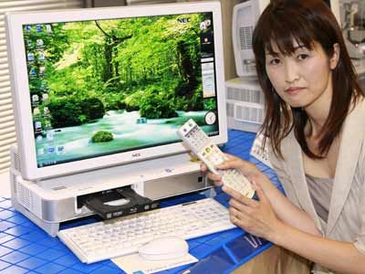 An employee of Japan's computer giant NEC shows off the world's first liquid cooled desktop PC 'Valuestar VW790', equipped with a CPU liquid cooling plate and hard drive (HDD) liquid cooling cold plate.