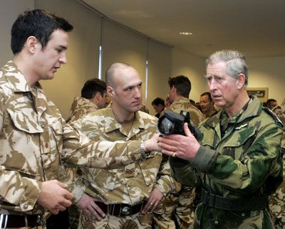 Prince Charles, Prince of Wales looks at a night vision sight during a visit to the 2nd Battalion Parachute Regiment at the University of Essex.