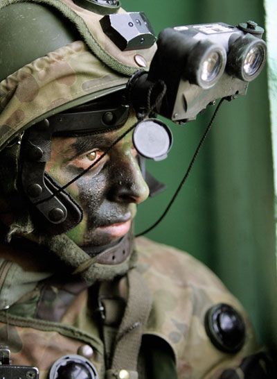 French army infantryman equiped with night vision goggles storms a simulated hotel at the training military camp of Sissonne.