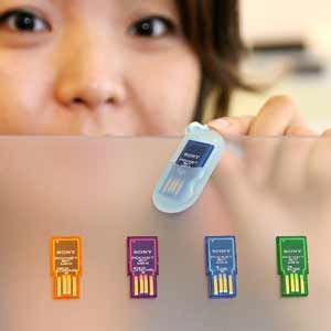 Sony employee displays the nail-sized flash memory card 'Pocket-bit mini', measuring 32 x 14.5 x 2.7mm and weighing only 1.5g, which enables it to connect to a USB port and is compatible with high-speed USB 2.0 data transfer.