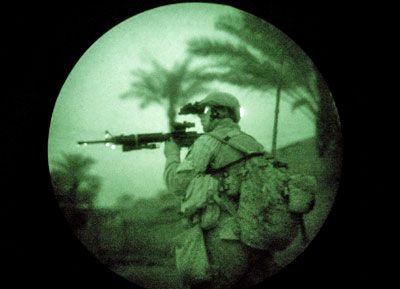 A U.S. Marine uses night vision goggles while on a search operation in the early hours of February 1, 2007 in Ramadi in Iraq's Anbar province.