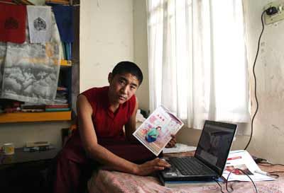 Tibetan Buddhist monk in-exile, Choedak poses with his cousin sister's photograph who was allegedly killed March 16 in Amdo Nyang district of Tibet.
