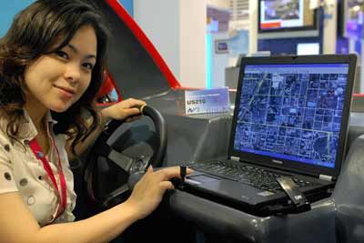 A model displays a laptop at a WiMAX exhibition at the Taipei World Trade Centre.