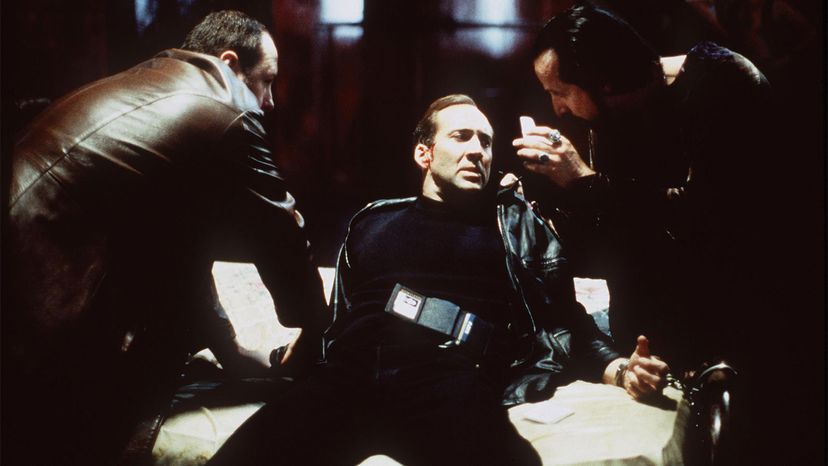 American actors Nicolas Cage and James Gandolfini with Swedish actor Peter Stormare in a scene from the movie "8MM" directed by Joel Schumacher, 1999.		 Hulton Archive/Getty Images