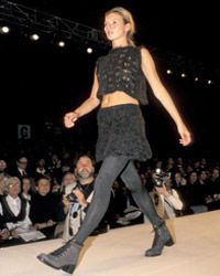 Model Kate Moss walks the Nicole Miller Fall Fashion Show in April 1994.